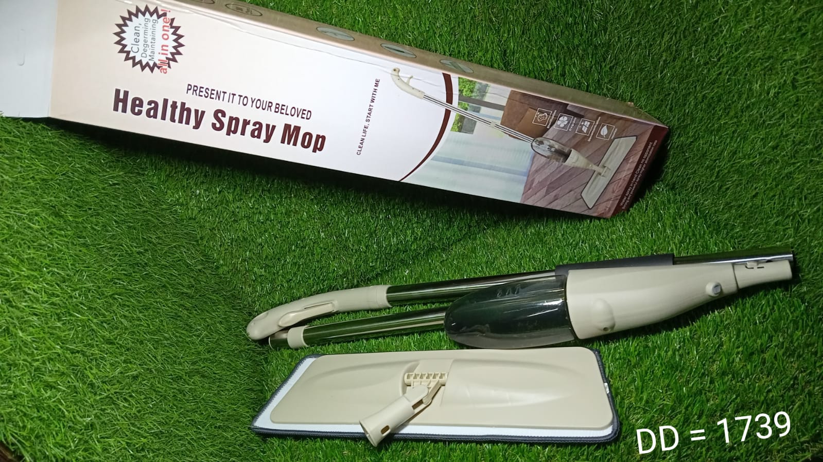 Spray mop with ergonomic handle and removable pad Spray mop with ergonomic handle and removable pad